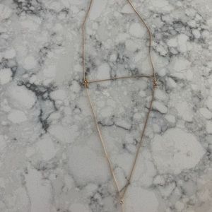 Leaf plated gold tiered necklace. Long